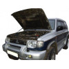 Амортизатор (упор) капота на Mitsubishi Pajero 02-10